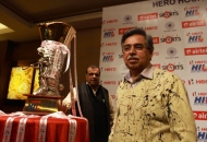 Managing Director & CEO of Hero MotoCorp Ltd Mr. Pawan Munjal with the Hero Hockey India League Trophy
