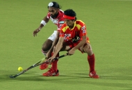 kothajit-singh-in-red-in-action-during-17th-match-of-hhil2013-at-ranchi