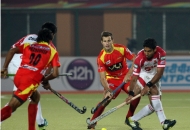 ranchi-rhinos-players-in-red-jersey-and-mumbai-magician-players-in-white-jersey-in-action-during-17th-match-of-hhil-2013-at-astroturf-hockey-stadium-at-ranchi-on-date-28-jan-2013-3
