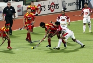 ranchi-rhinos-players-in-red-jersey-and-mumbai-magician-players-in-white-jersey-in-action-during-17th-match-of-hhil-2013-at-astroturf-hockey-stadium-at-ranchi-on-date-28-jan-2013