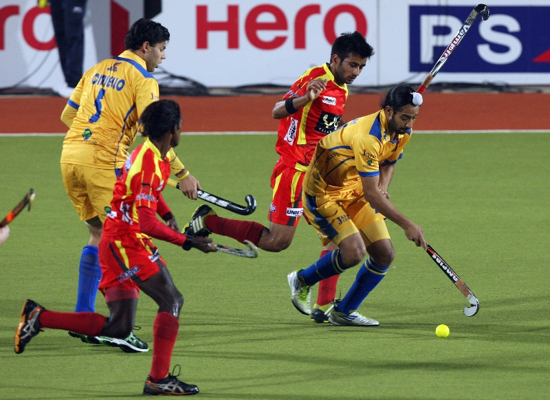 rr-player-in-red-and-jpw-player-in-yellow-in-action-during-24-match-of-hhil2013-at-ranchi