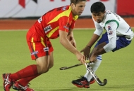 rr-player-in-red-and-upw-player-in-whit-jersey-in-action-during-12-match-of-hhil2013-at-astroturf-hockey-stadium-ranchi-on-date-24-jan-2013-2